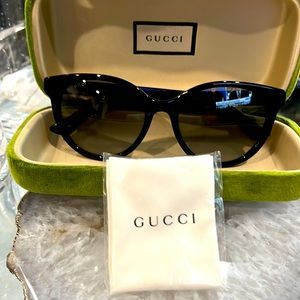 Authentic Gucci Sunglasses in original case.